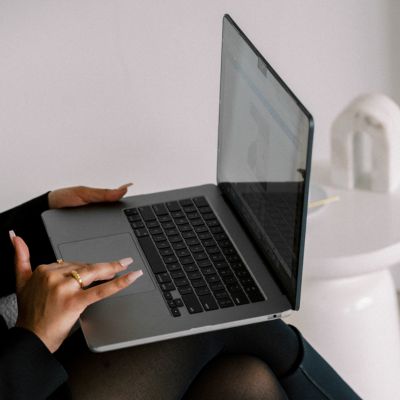 Woman typing on laptop