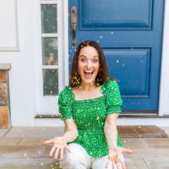 Sarah throwing confetti to celebrate women entrepreneurs learning how to refocus their sales efforts by selling from the heart